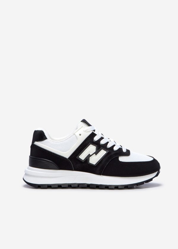 New Balance black and white 574 low top sneakers
